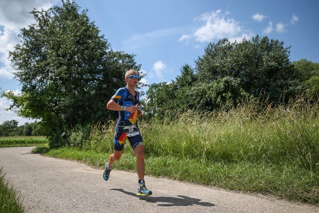 KRAICHGAU, GERMANY - JUNE 03:  Athletes compete in the running leg during the Sparkasse IRONMAN 70.3 Kraichgau powered by KraichgauEnergie on June 3, 2018 in Kraichgau, Germany.  (Photo by Joern Pollex/Getty Images for IRONMAN)