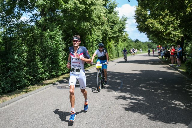 KRAICHGAU, GERMANY - JUNE 03:  Jan Frodeno competes in the run leg during the Sparkasse IRONMAN 70.3 Kraichgau powered by KraichgauEnergie on June 3, 2018 in Kraichgau, Germany.  (Photo by Joern Pollex/Getty Images for IRONMAN)