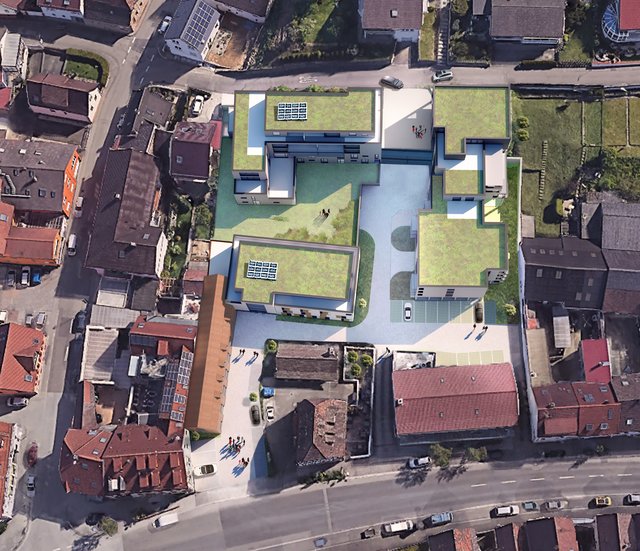 Gesundheitszentrum Jöhlingen: Vogelperspektive mit fußläufigem Zugang von der Jöhlinger Straße (unten) und Zufahrt von der Schubertstraße (oben), Haus der Gesundheit (langes Gebäude und anschließender rechteckiger Block), Haus der Pflege (darüber und oben angrenzend an Schubertstraße) sowie Haus des Wohnens (rechts, ebenfalls mit begrüntem Dach). Visualisierung: Curavia